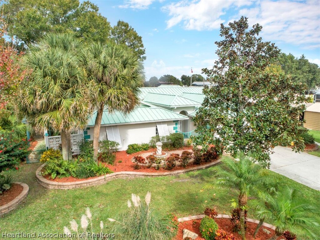 374 Cloverleaf Road Lake Placid, FL 33852 - Photo 24 of 26 a view of a backyard with plants and a garden