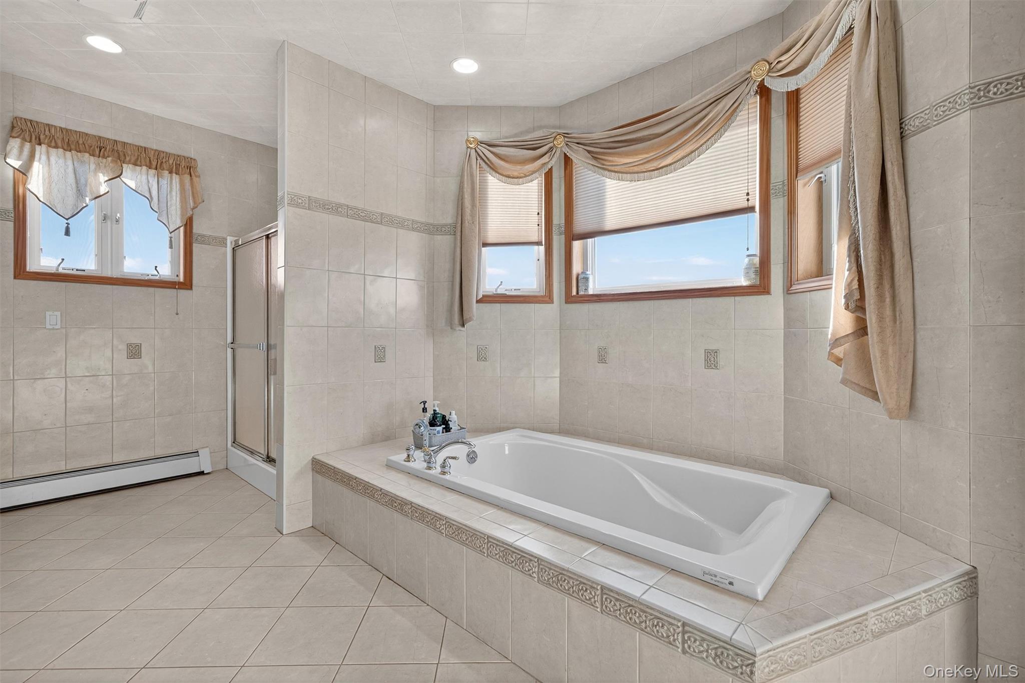 30 Heather Court Middletown, NY 10941 - Photo 19 of 50 a spacious bathroom with a tub and a shower