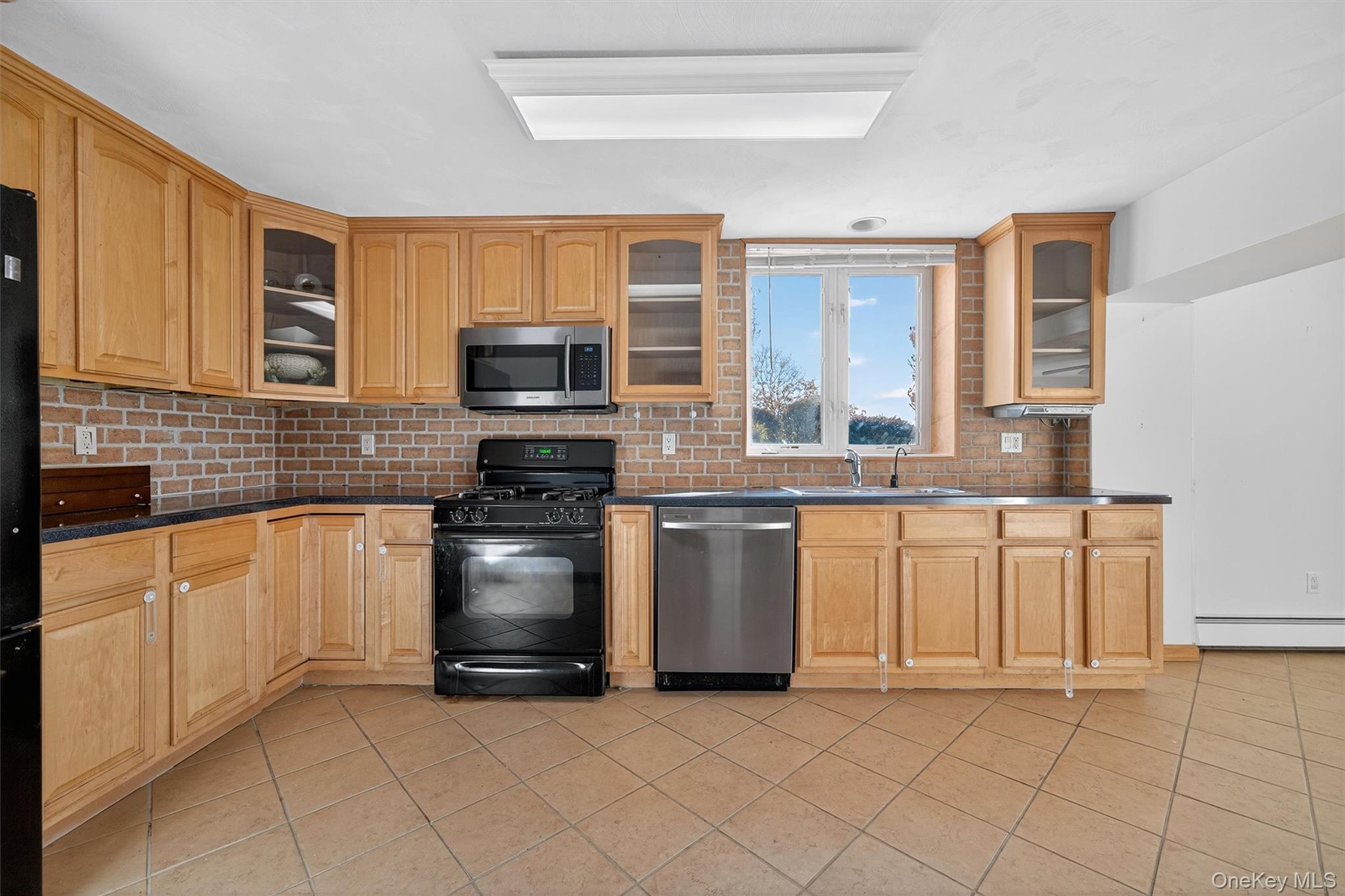 30 Heather Court Middletown, NY 10941 - Photo 26 of 50 a kitchen with granite countertop a stove top oven and cabinets