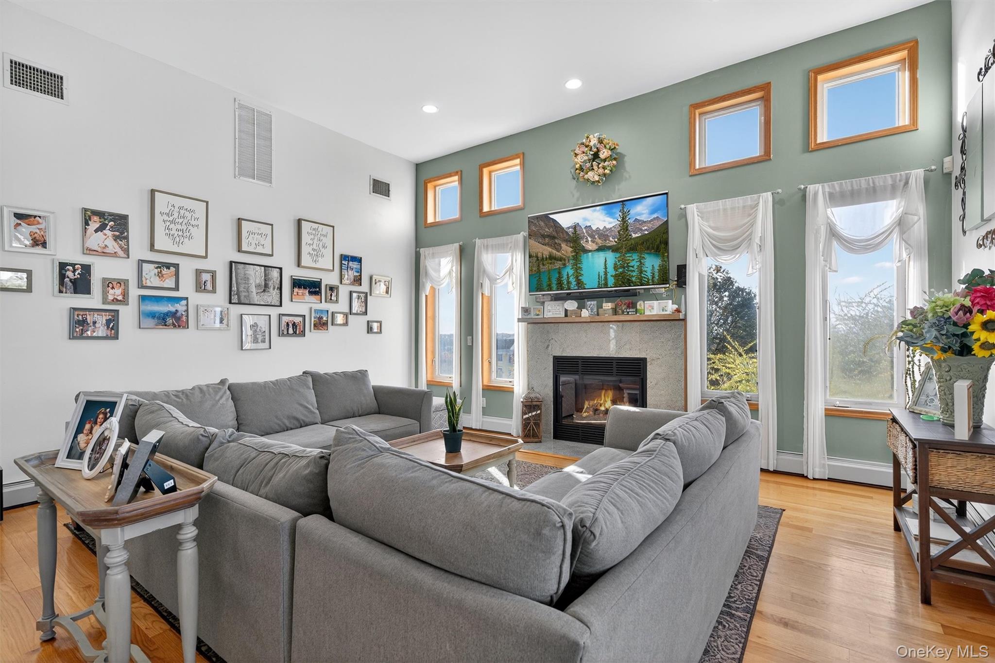 30 Heather Court Middletown, NY 10941 - Photo 6 of 50 a living room with furniture a flat screen tv and a fireplace