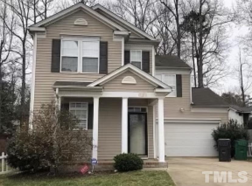 8566 Filbert Lane Charlotte, NC 28215 - Photo 1 of 4 a front view of a house with garden
