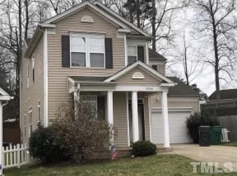 8566 Filbert Lane Charlotte, NC 28215 - Photo 2 of 4 a front view of a house with a yard