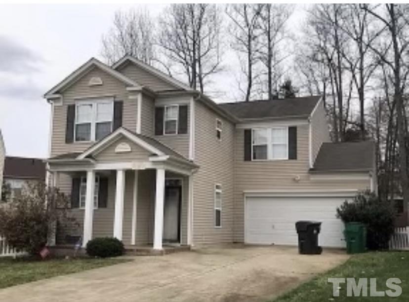 8566 Filbert Lane Charlotte, NC 28215 - Photo 3 of 4 a front view of a house with a yard