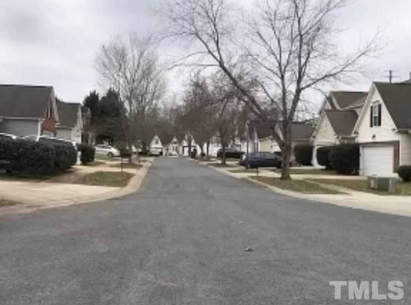 8566 Filbert Lane Charlotte, NC 28215 - Photo 4 of 4 a view of road with houses