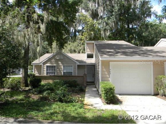 405 Northwest 48th Boulevard Gainesville, FL 32607 - Photo 1 of 1 a front view of a house with a garden