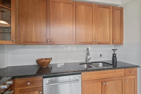 a stove top oven sitting inside of a kitchen