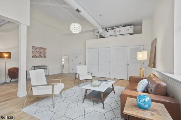 a living room with furniture and a table