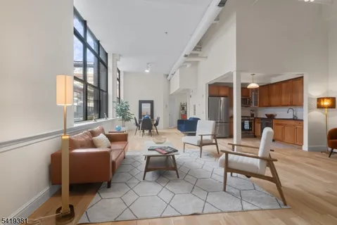 a living room with furniture and a table