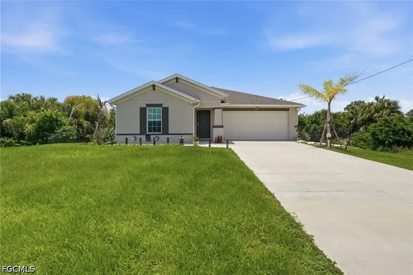 a front view of a house with yard