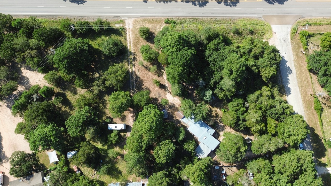 109 Travis Road Paige, TX 78659 - Photo 17 of 39 an aerial view of residential houses with outdoor space and trees