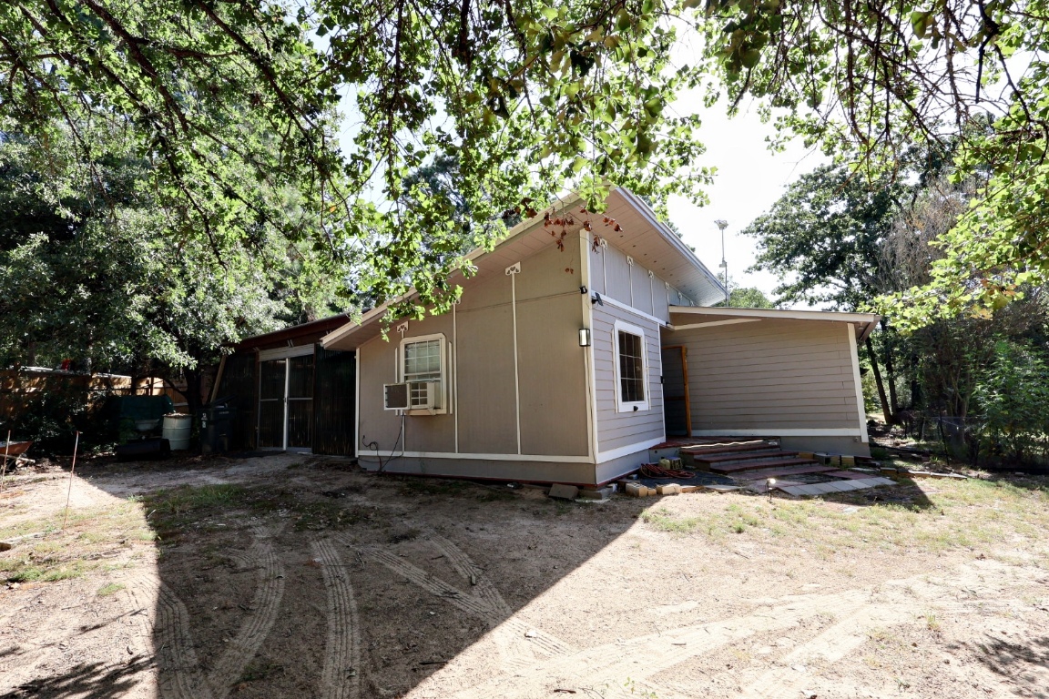 109 Travis Road Paige, TX 78659 - Photo 24 of 39 a view of a house with a yard