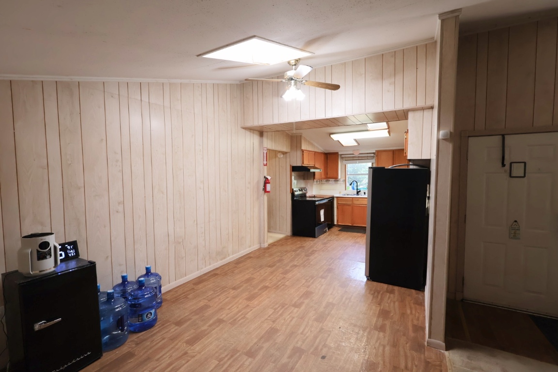 109 Travis Road Paige, TX 78659 - Photo 27 of 39 a view of a kitchen with cabinets and stainless steel appliances