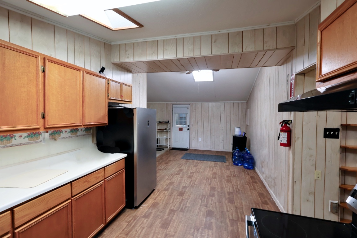 109 Travis Road Paige, TX 78659 - Photo 31 of 39 a kitchen with stainless steel appliances a refrigerator and a stove
