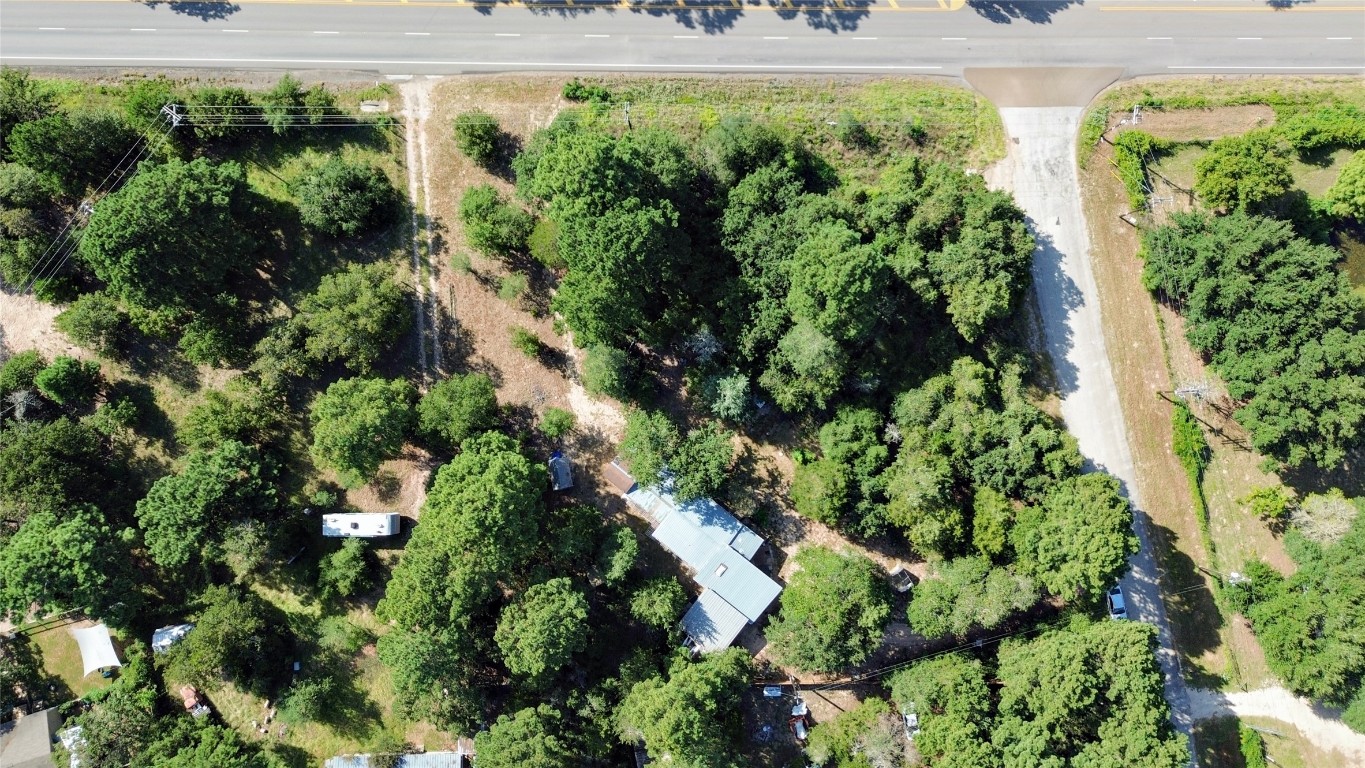 109 Travis Road Paige, TX 78659 - Photo 34 of 39 an aerial view of residential house with outdoor space and street view