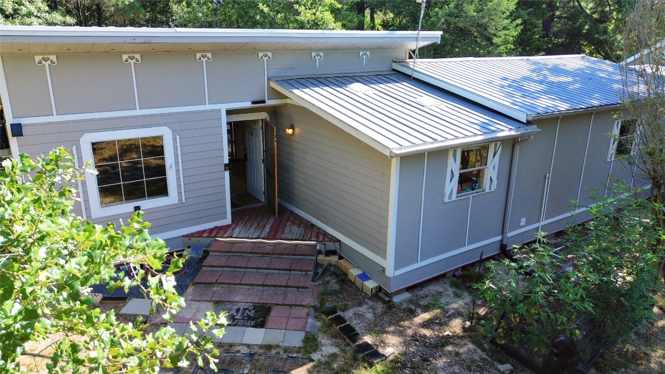 109 Travis Road Paige, TX 78659 - Photo 9 of 39 a view of a wooden door of the house