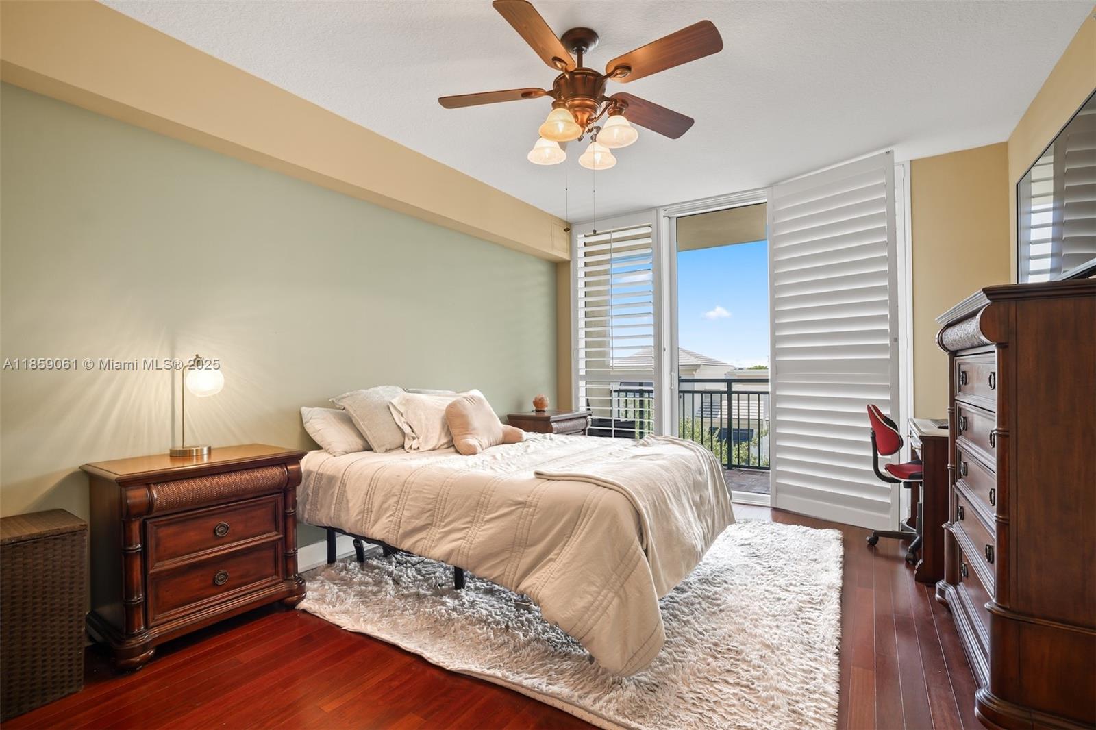 510 Northwest 84th Avenue, Unit 445 Plantation, FL 33324 - Photo 14 of 42 a bedroom with a bed and a chandelier