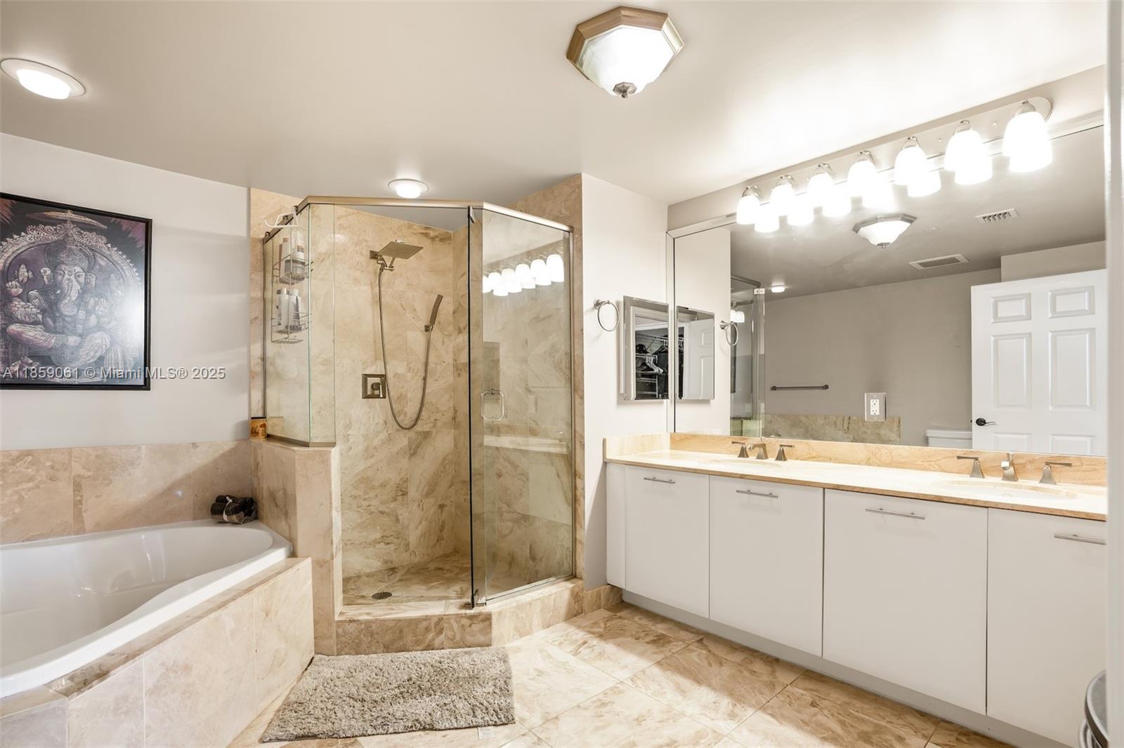 510 Northwest 84th Avenue, Unit 445 Plantation, FL 33324 - Photo 17 of 42 a bathroom with a tub a sink shower and mirror