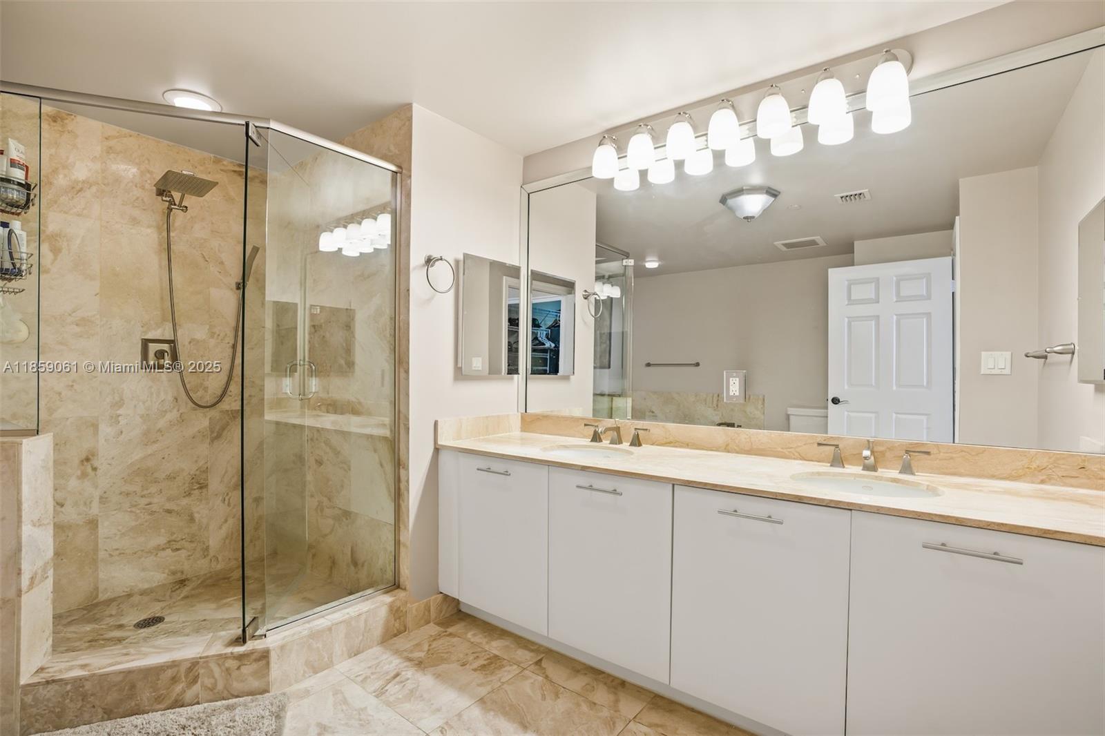510 Northwest 84th Avenue, Unit 445 Plantation, FL 33324 - Photo 18 of 42 a bathroom with a shower sink and mirror