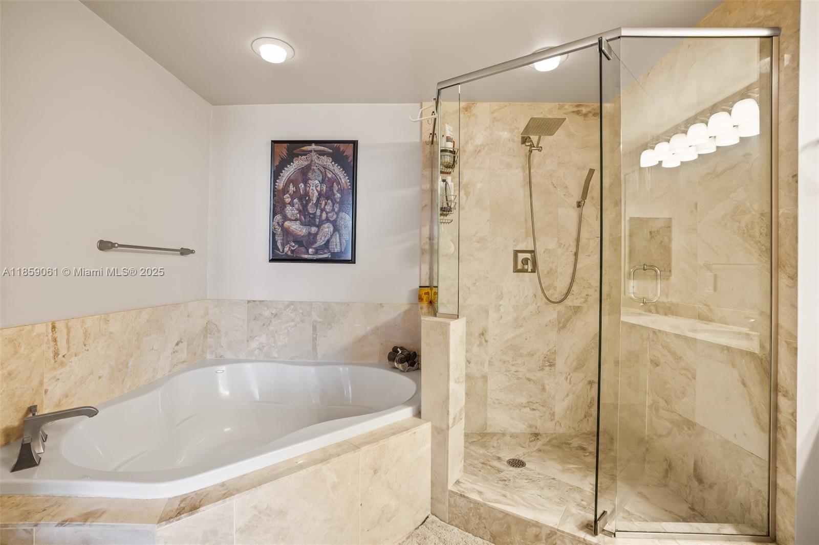 510 Northwest 84th Avenue, Unit 445 Plantation, FL 33324 - Photo 19 of 42 a bathroom with a bathtub and a shower