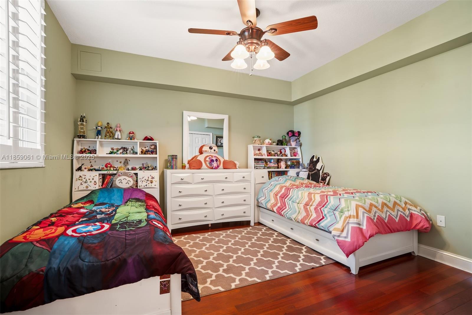 510 Northwest 84th Avenue, Unit 445 Plantation, FL 33324 - Photo 21 of 42 a bedroom with a bed and a chandelier