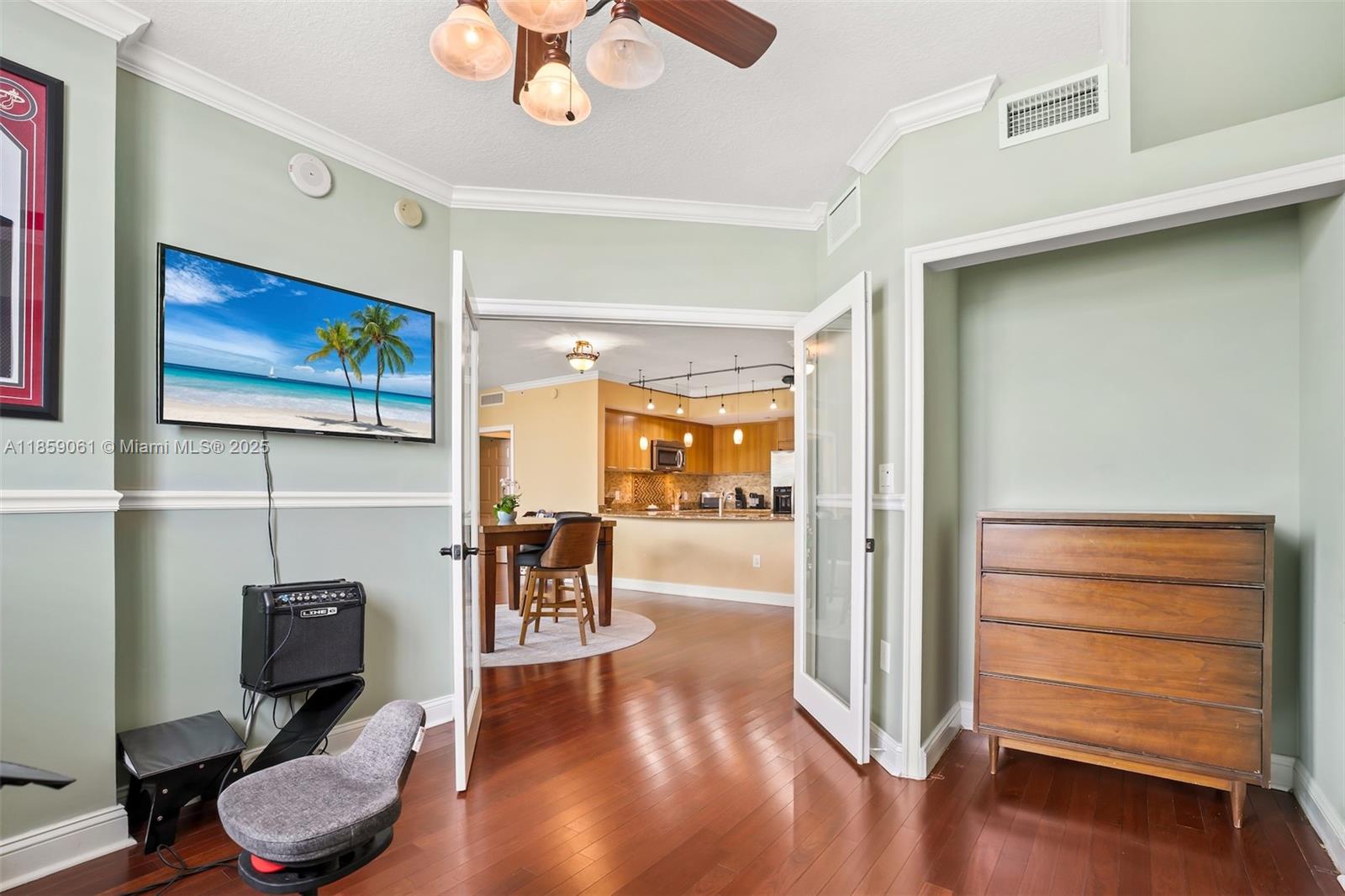 510 Northwest 84th Avenue, Unit 445 Plantation, FL 33324 - Photo 26 of 42 a living room with furniture and a flat screen tv