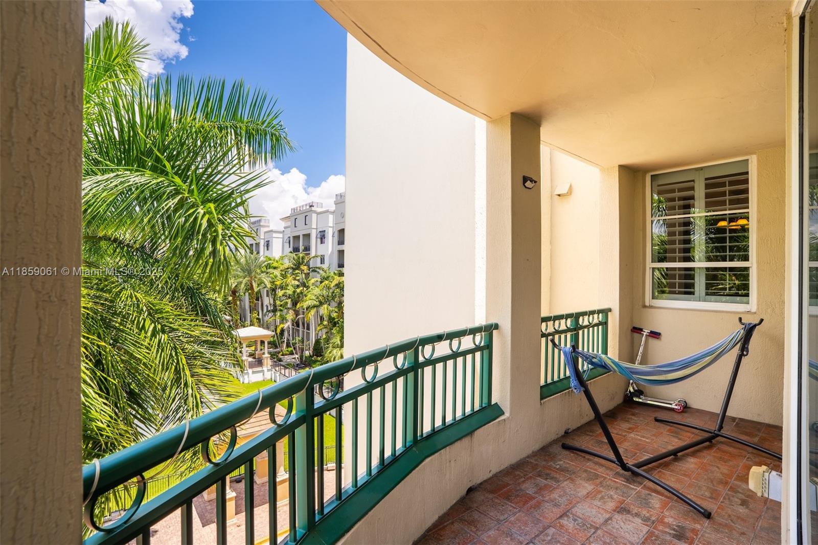 510 Northwest 84th Avenue, Unit 445 Plantation, FL 33324 - Photo 29 of 42 a porch with a bench