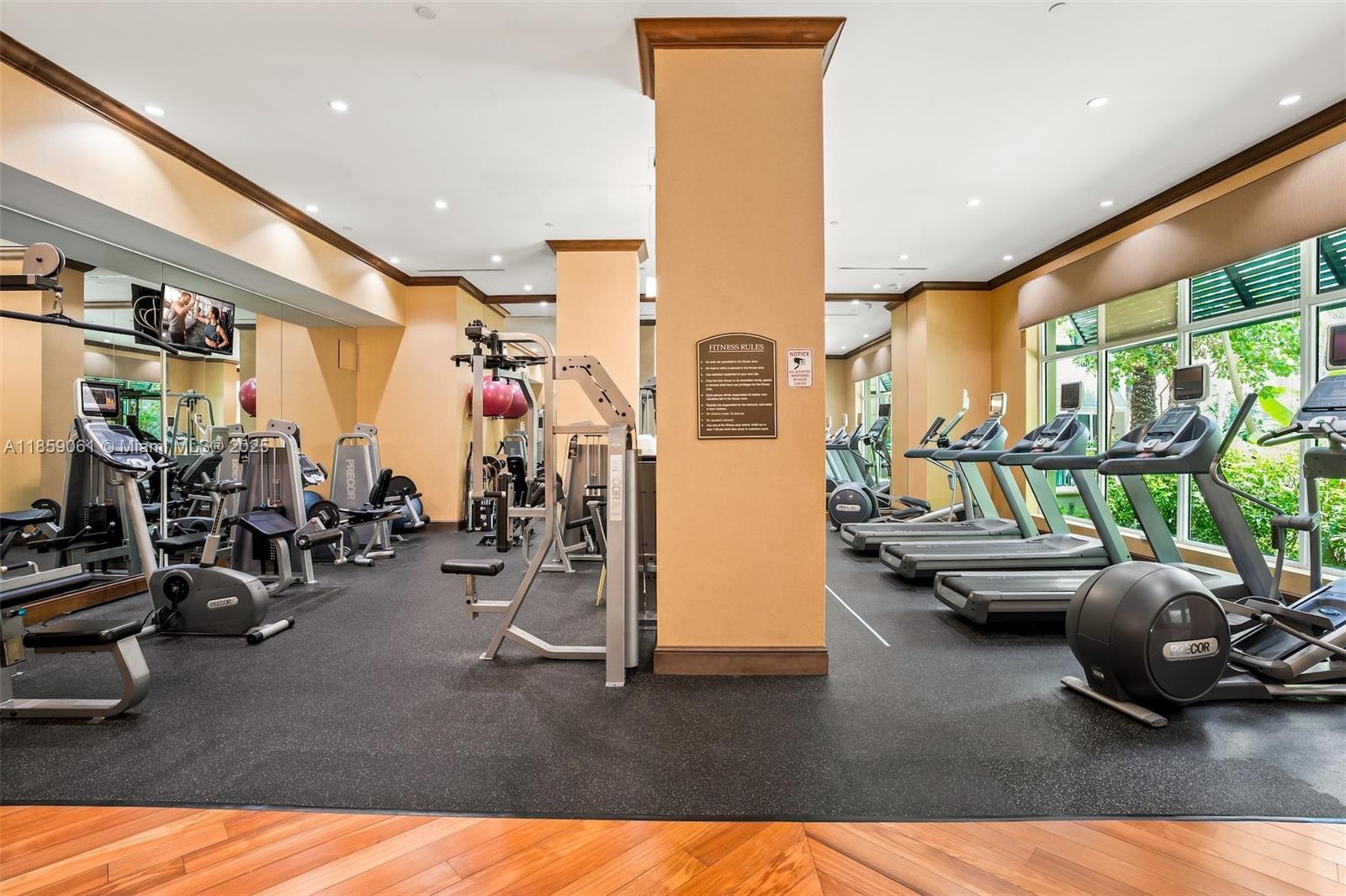 510 Northwest 84th Avenue, Unit 445 Plantation, FL 33324 - Photo 38 of 42 a living room with furniture and a floor to ceiling window