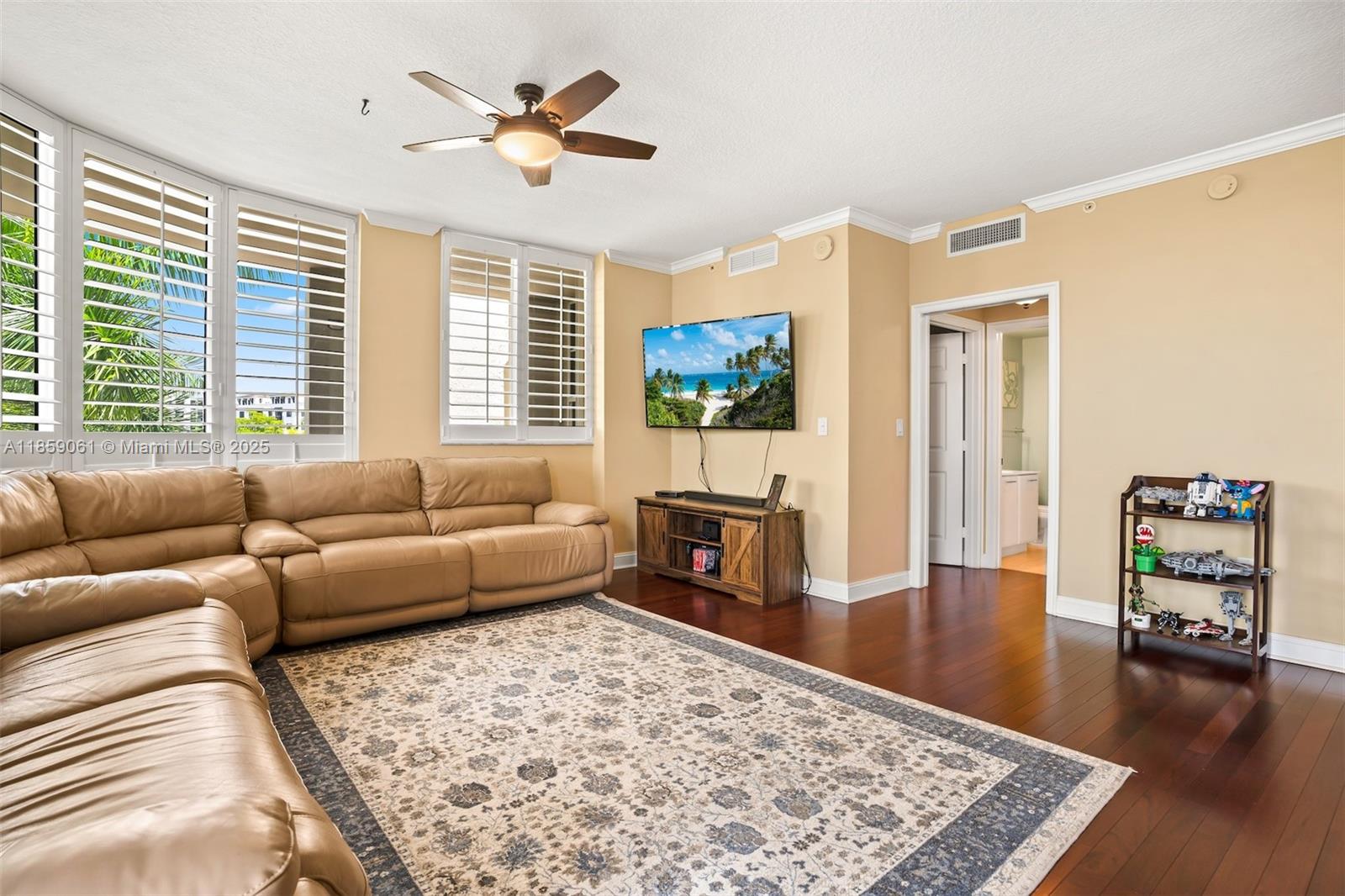 510 Northwest 84th Avenue, Unit 445 Plantation, FL 33324 - Photo 5 of 42 a living room with furniture and a flat screen tv