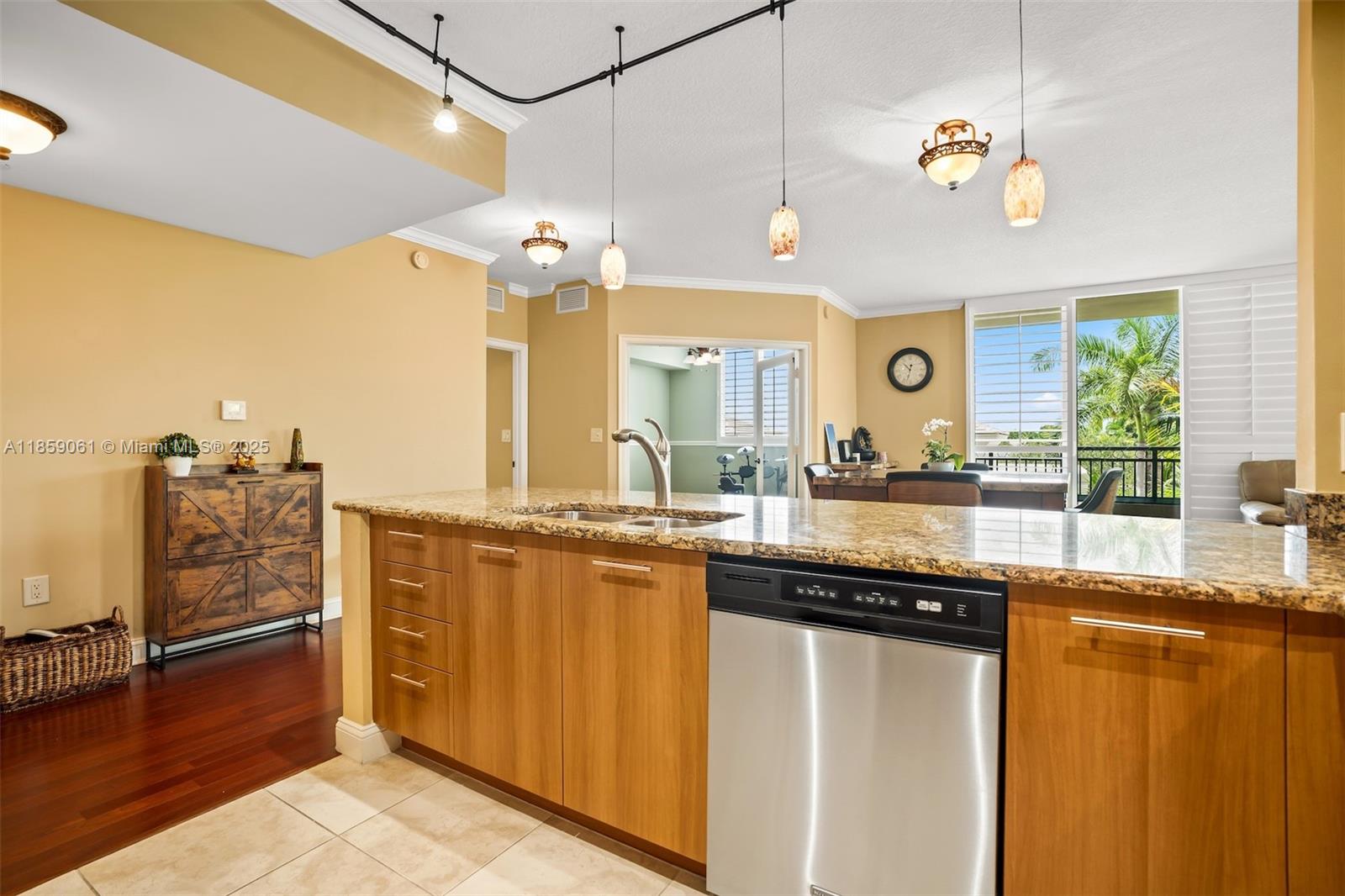 510 Northwest 84th Avenue, Unit 445 Plantation, FL 33324 - Photo 10 of 42 a kitchen with granite countertop a sink and cabinets