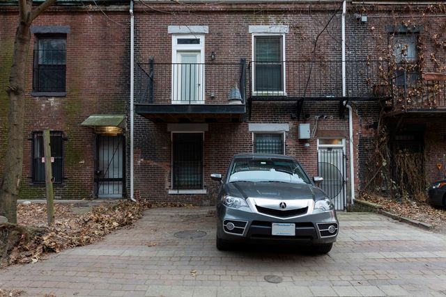 a car parked in front of a building
