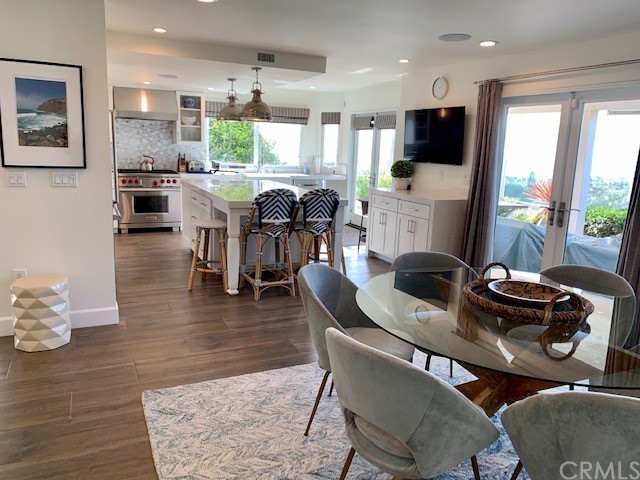 5 Regatta Way Dana Point, CA 92629 - Photo 16 of 36 a dining room with furniture a large window and a chandelier