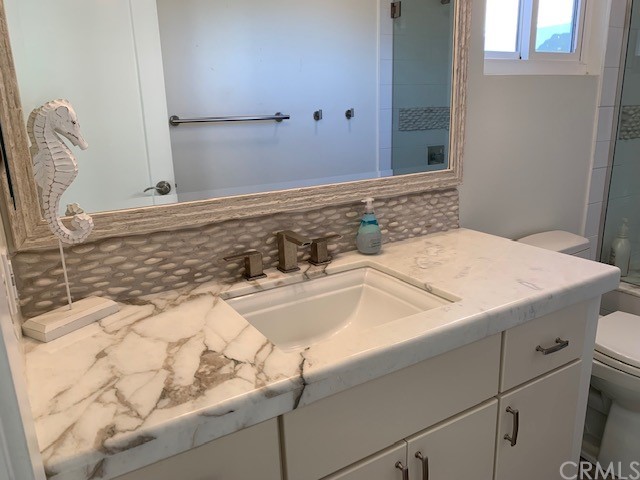 5 Regatta Way Dana Point, CA 92629 - Photo 19 of 36 a bathroom with a sink and a mirror