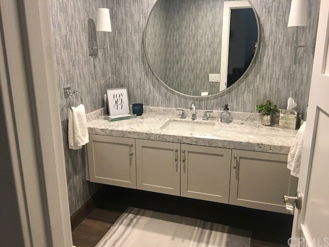 5 Regatta Way Dana Point, CA 92629 - Photo 20 of 36 a bathroom with a granite countertop sink and a mirror