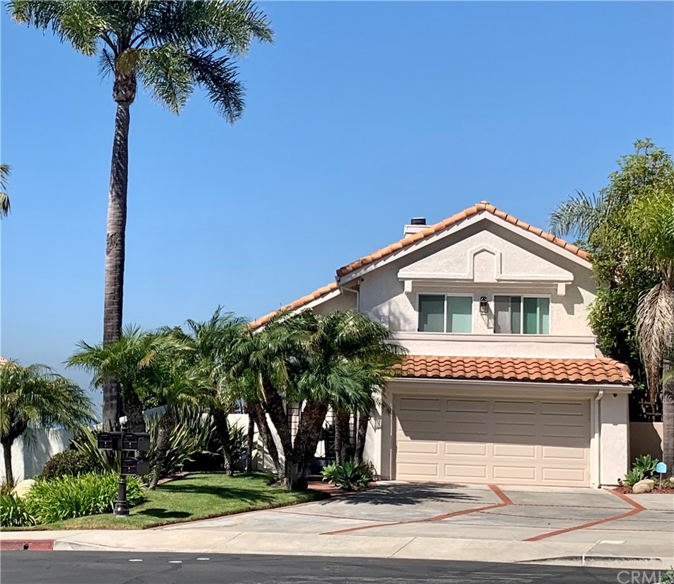 5 Regatta Way Dana Point, CA 92629 - Photo 6 of 36 a front view of a house with a garden
