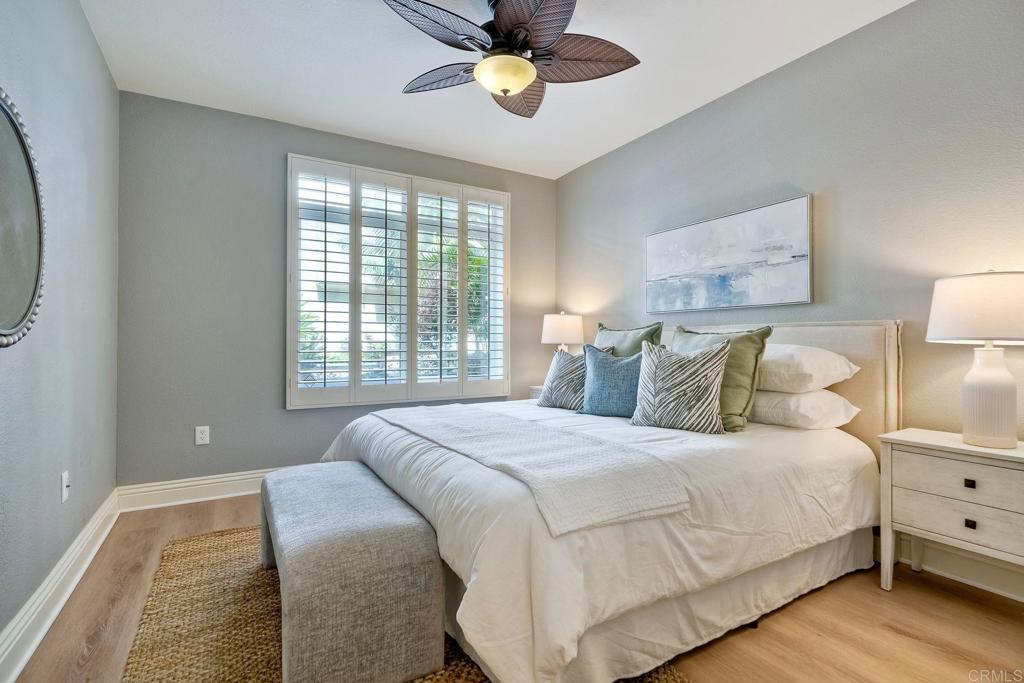 9263 Regents Road, Unit B106 La Jolla, CA 92037 - Photo 24 of 35 a bedroom with a bed and window