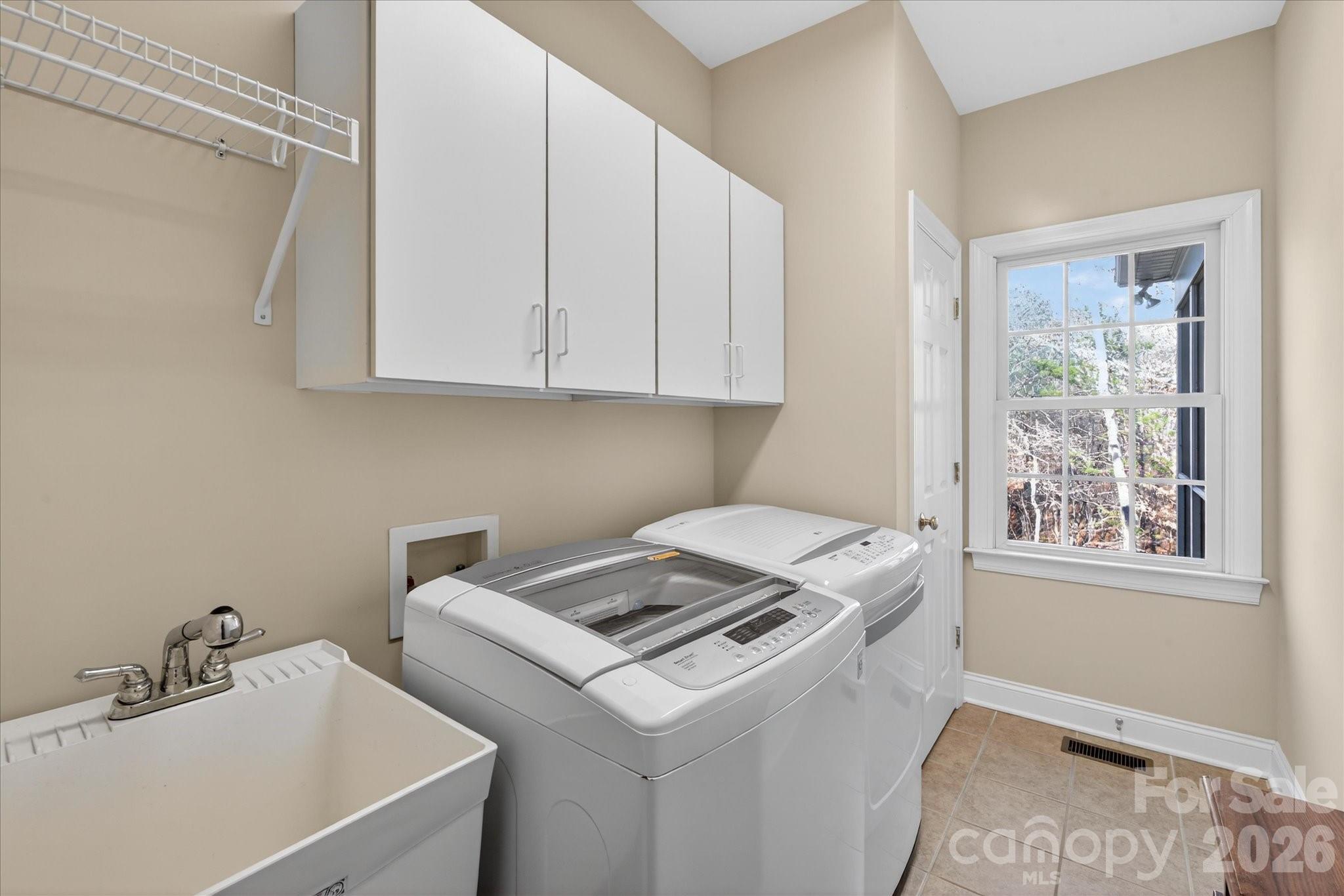 1237 Waynewood Drive Waxhaw, NC 28173 - Photo 13 of 32 a view of storage and utility room with washer and dryer