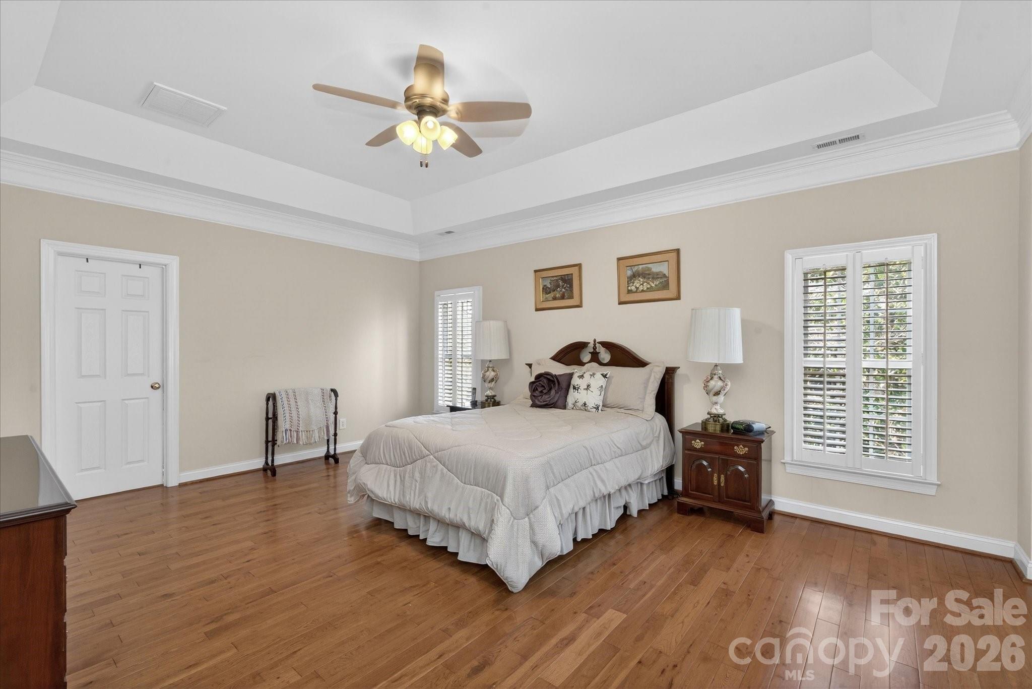 1237 Waynewood Drive Waxhaw, NC 28173 - Photo 16 of 32 a bedroom with a bed and a chandelier