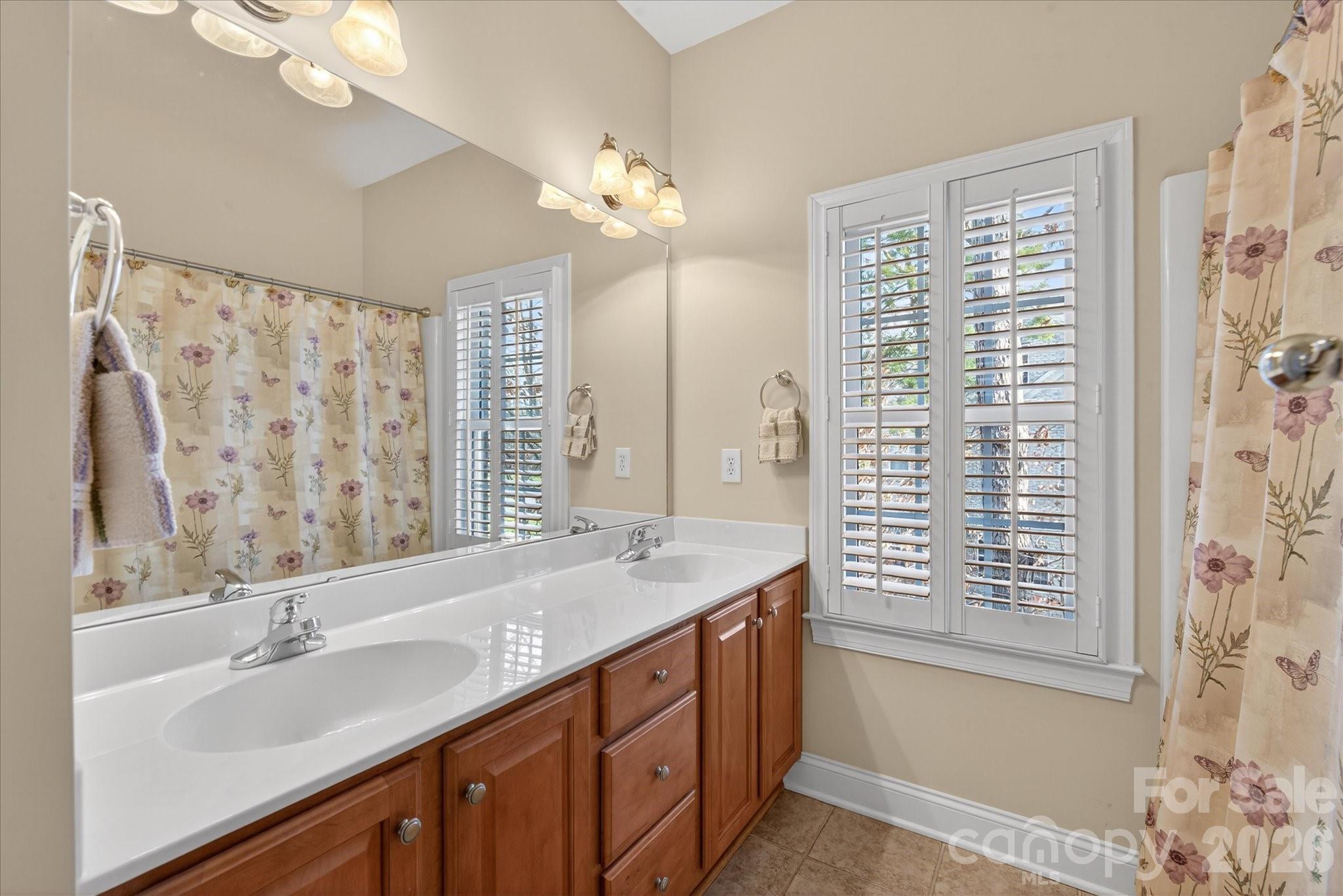 1237 Waynewood Drive Waxhaw, NC 28173 - Photo 22 of 32 a bathroom with a double vanity sink mirror and double