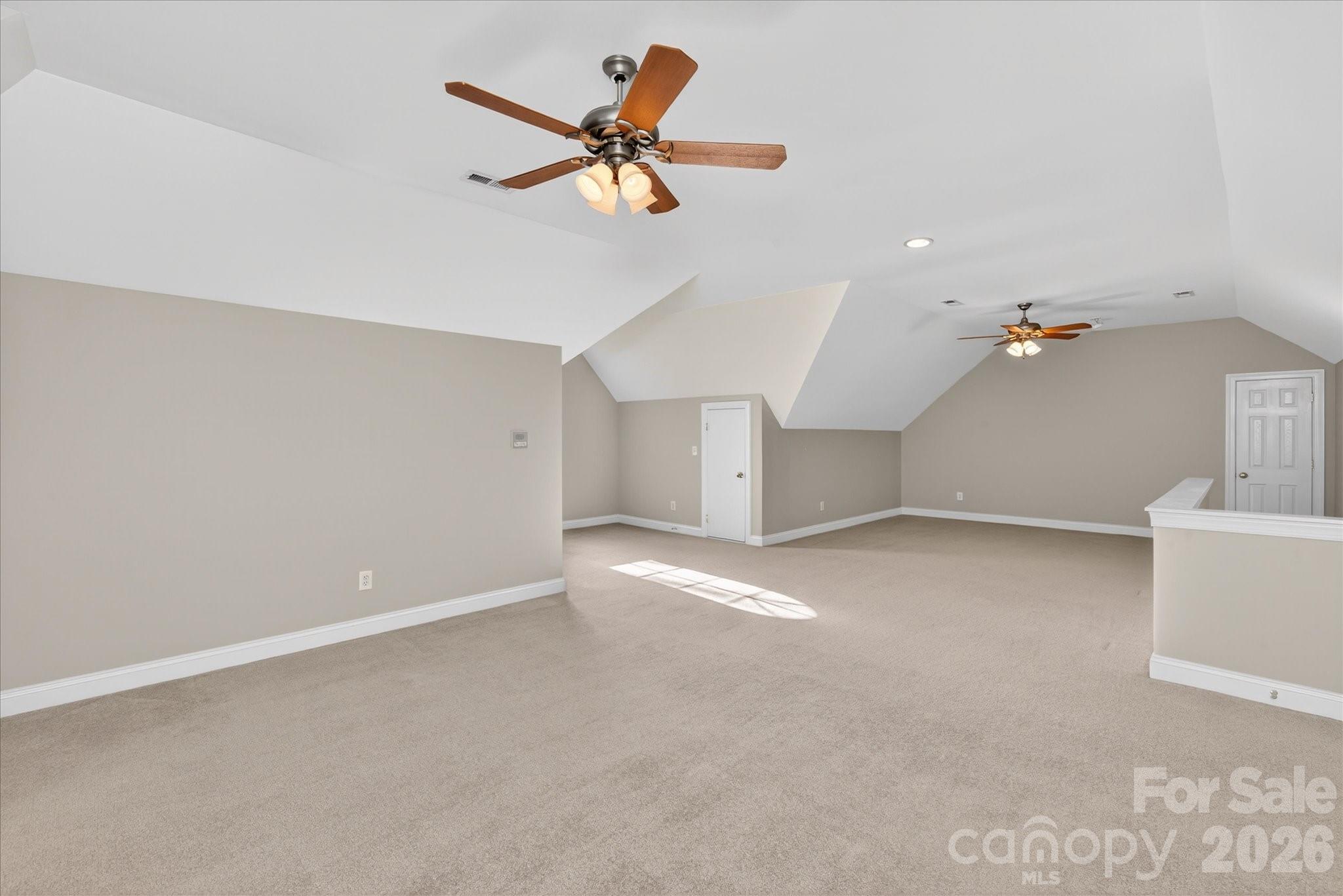 1237 Waynewood Drive Waxhaw, NC 28173 - Photo 27 of 32 a view of a livingroom with a ceiling fan and window