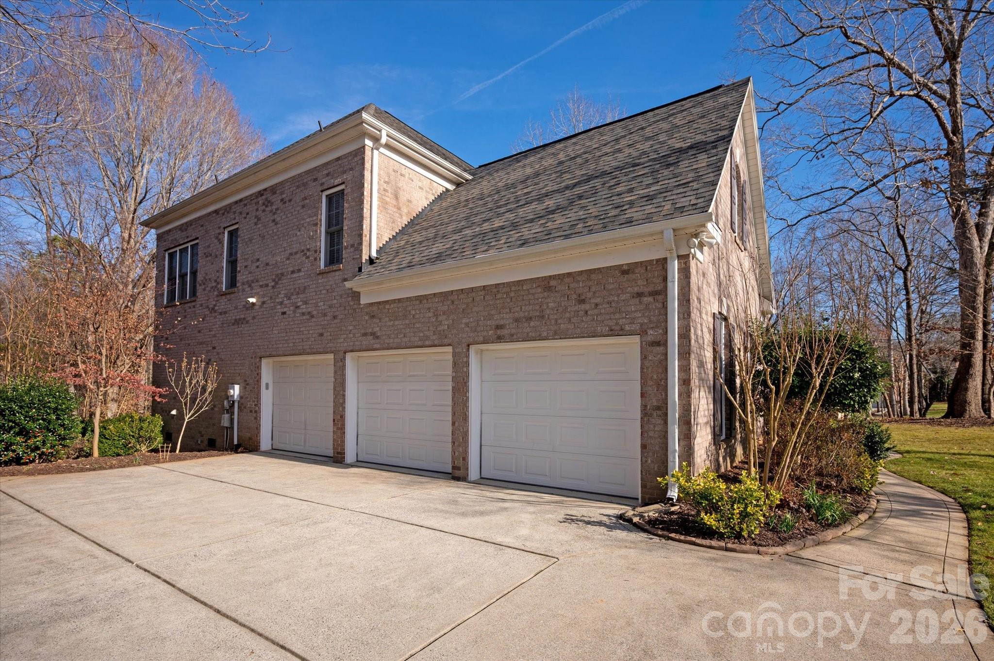 1237 Waynewood Drive Waxhaw, NC 28173 - Photo 31 of 32 a front view of a house with garden