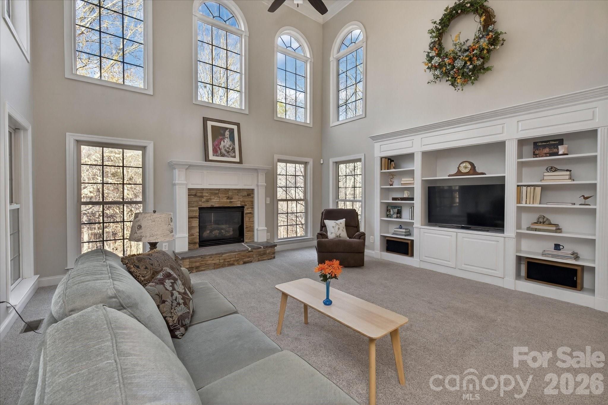 1237 Waynewood Drive Waxhaw, NC 28173 - Photo 8 of 32 a living room with furniture a flat screen tv and a fireplace