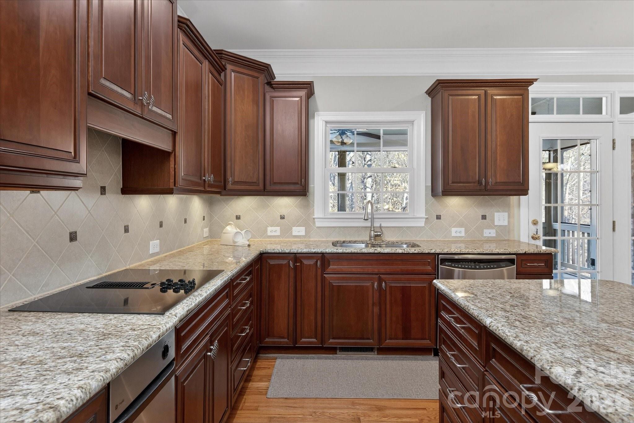 1237 Waynewood Drive Waxhaw, NC 28173 - Photo 10 of 32 a kitchen with a sink stove and cabinets