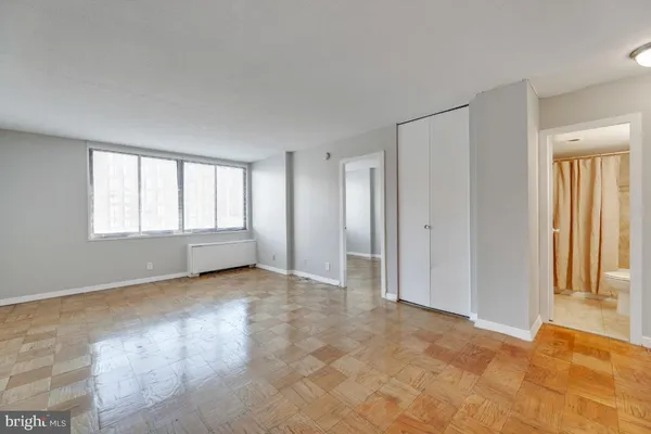 a view of an empty room with a window