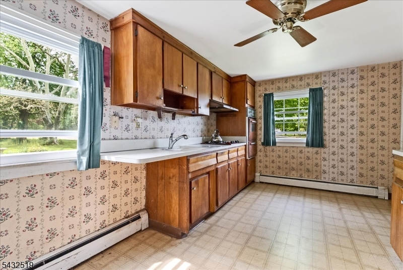 3225 Valley Road Bernards, NJ 07920 - Photo 11 of 24 a kitchen with stainless steel appliances granite countertop a refrigerator and a sink