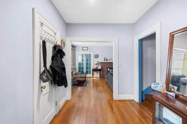 a living room with furniture a fireplace and a window