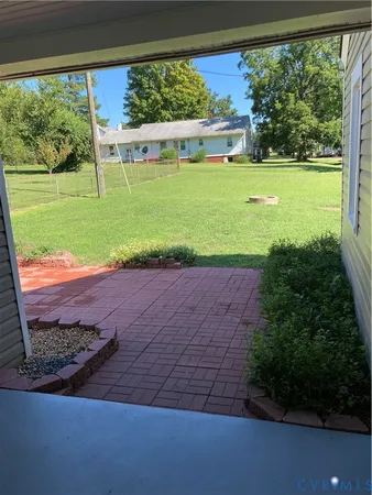 a view of a backyard with a garden and plants