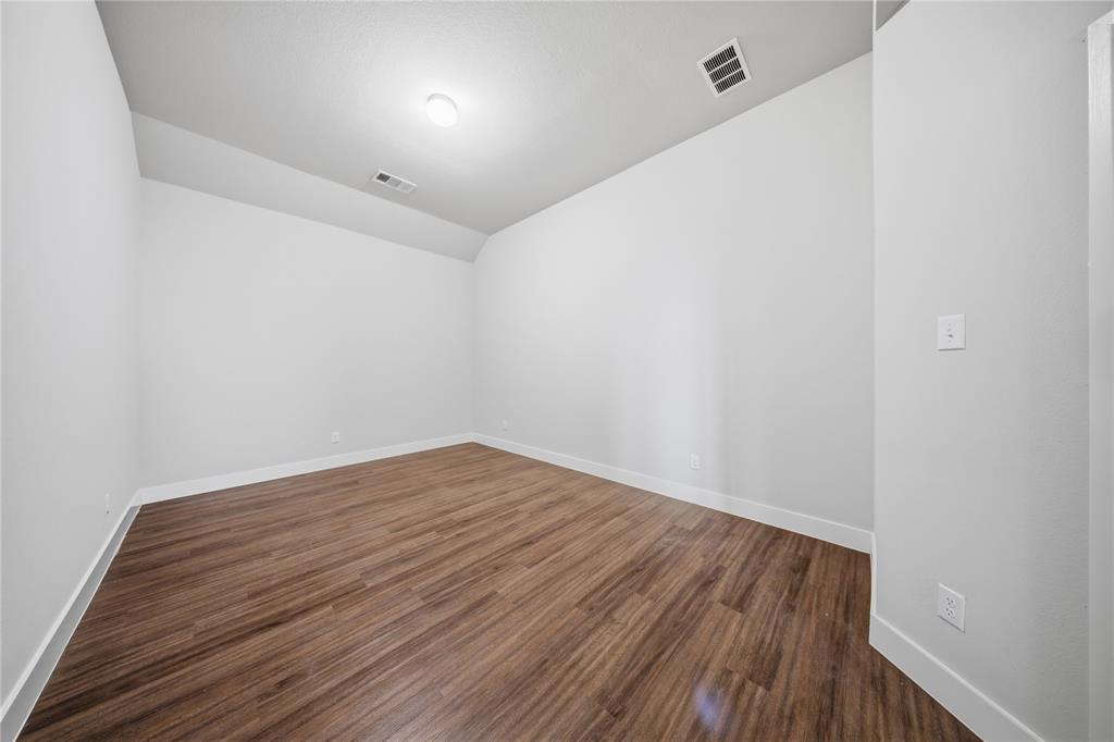 1665 Sheldon Drive Forney, TX 75126 - Photo 13 of 35 a view of room with wooden floor