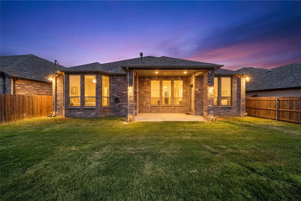 1665 Sheldon Drive Forney, TX 75126 - Photo 31 of 35 a front view of a house with a yard