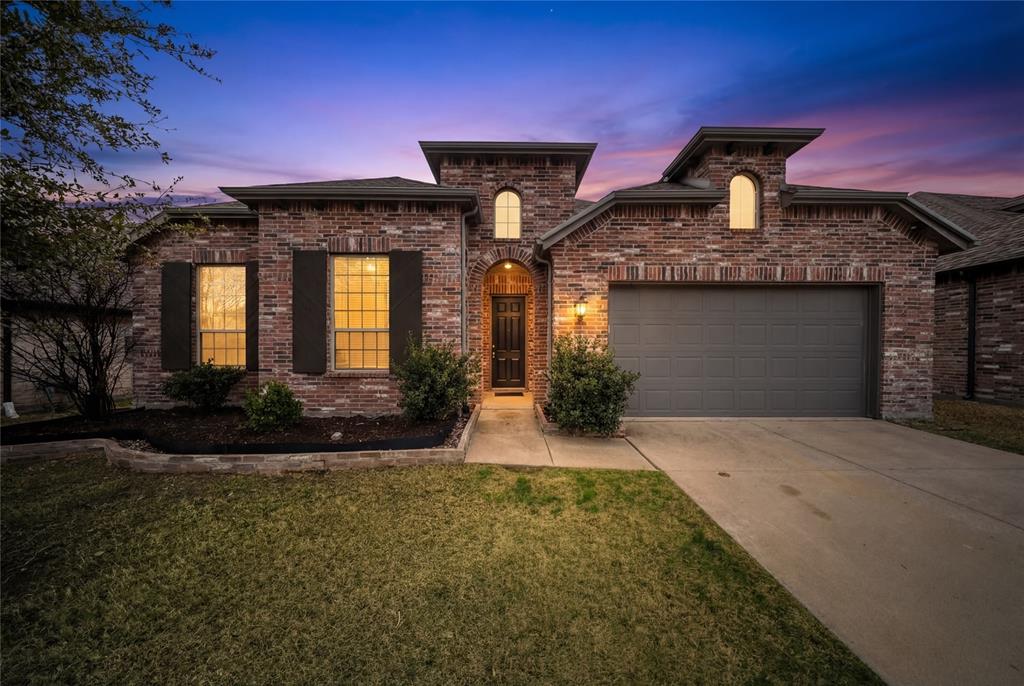 1665 Sheldon Drive Forney, TX 75126 - Photo 35 of 35 a front view of a house with garden