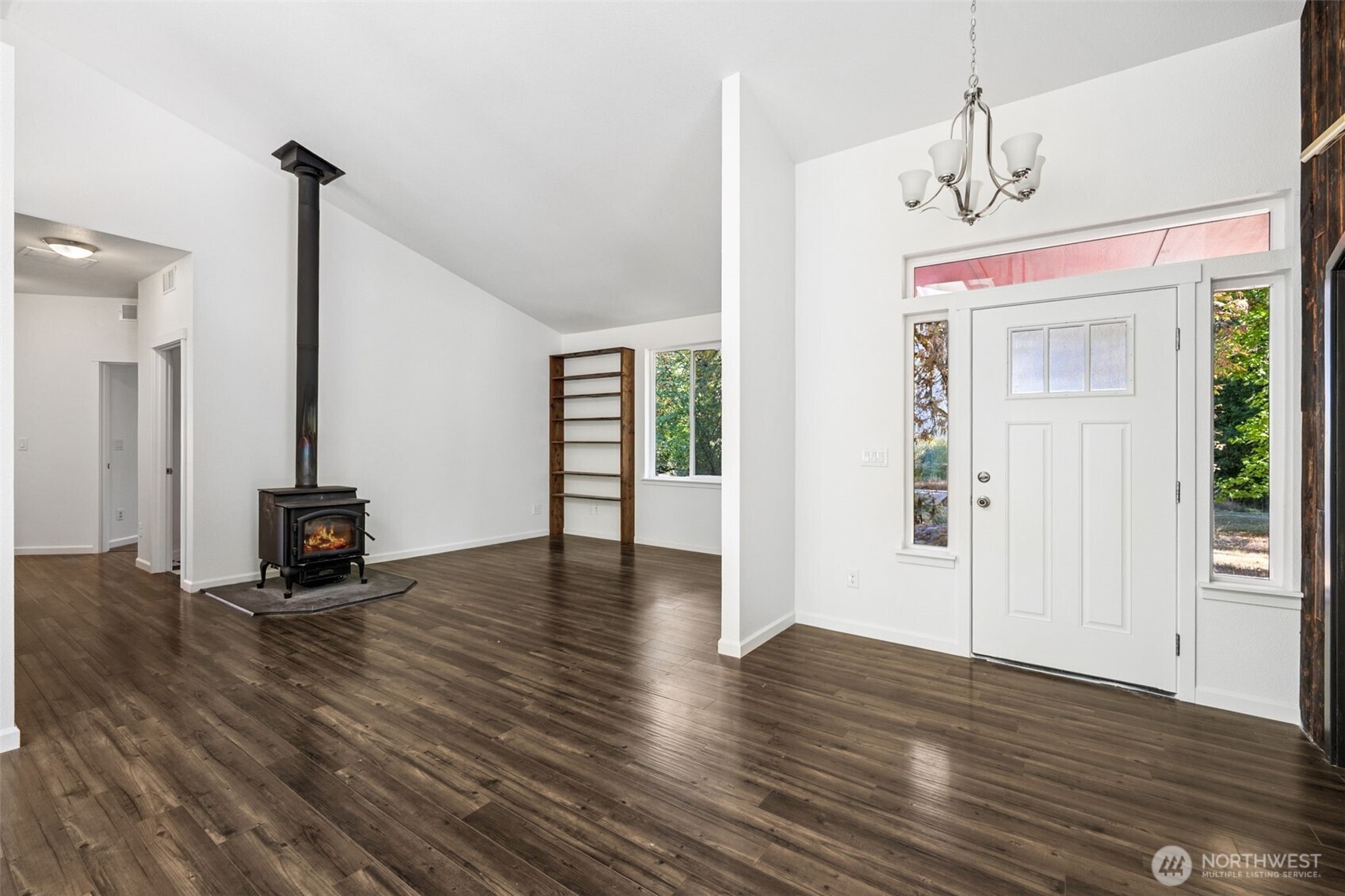 662 Cline Road Randle, WA 98377 - Photo 11 of 36 a view of a livingroom with wooden floor and a ceiling fan